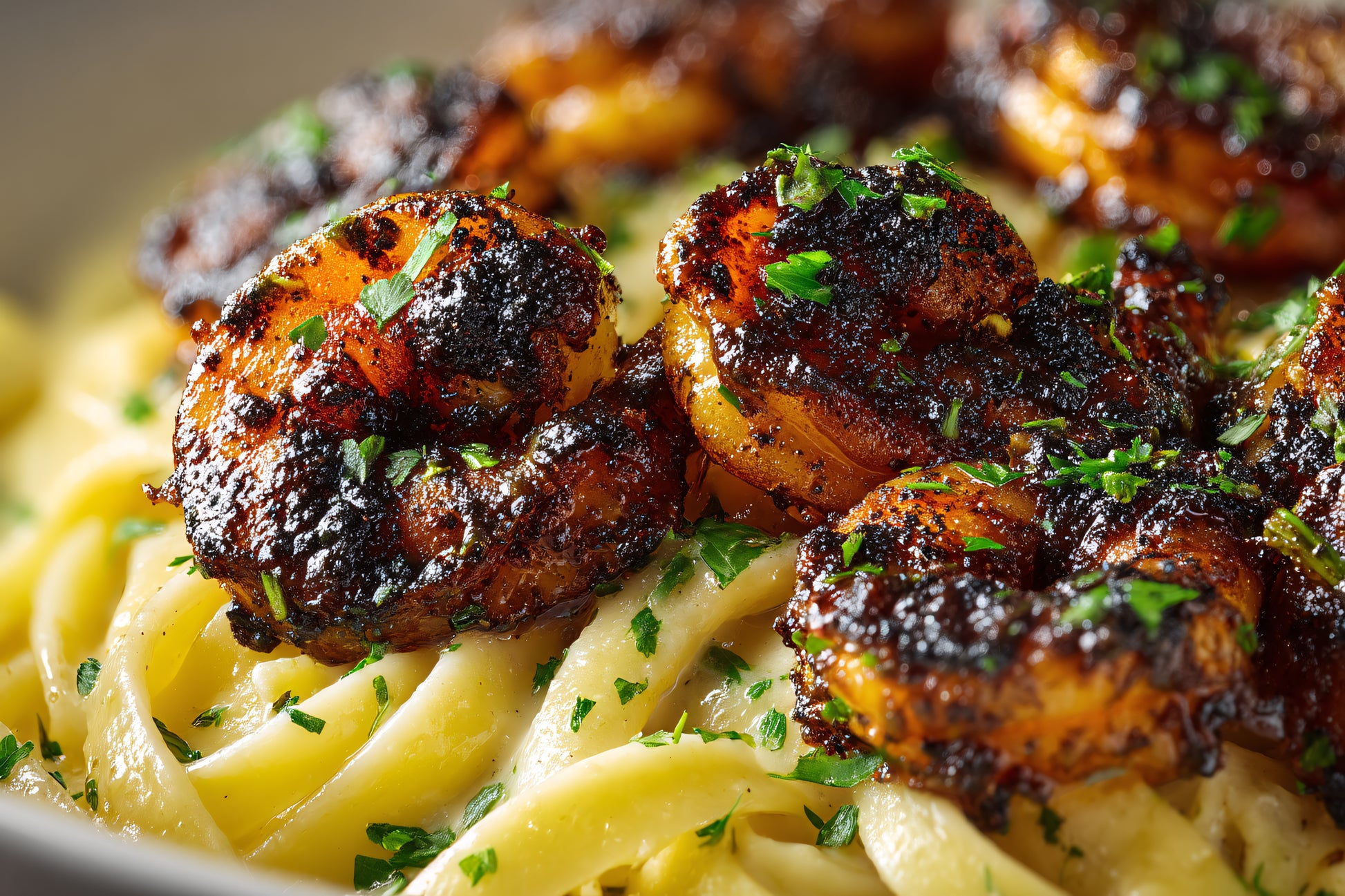Blackened shrimp over buttered fettuccine pasta, seasoned with SwissAm Blackened blend